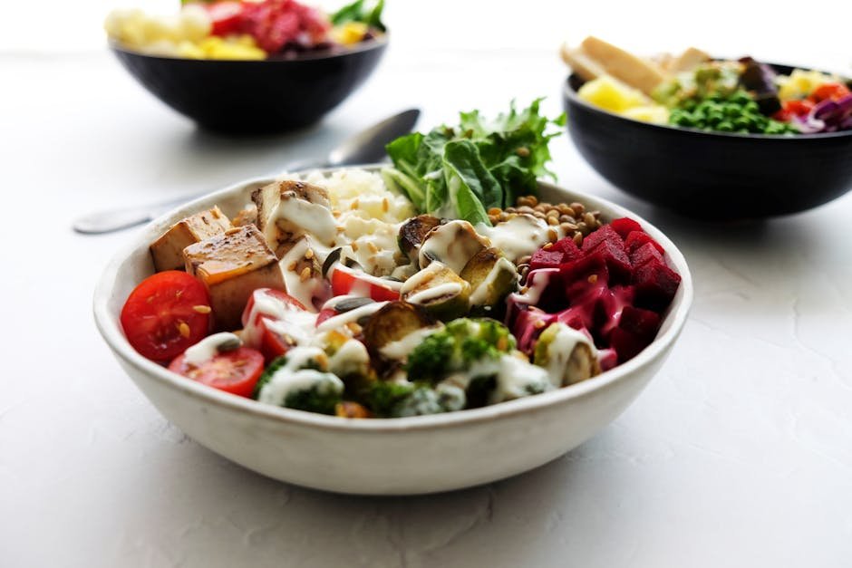 Vibrant vegan Buddha bowl filled with fresh vegetables and healthy ingredients.